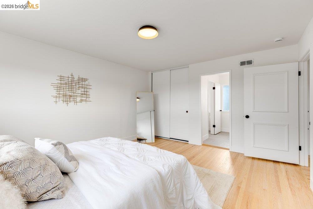 1298 Ribbon Street Foster City, CA 94404 - Photo 59 of 86 Bedroom with light wood-finish flooring, white walls, and a contemporary flush-mount ceiling light