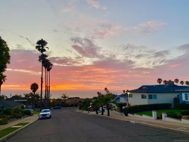 a view of a street with a building in the background