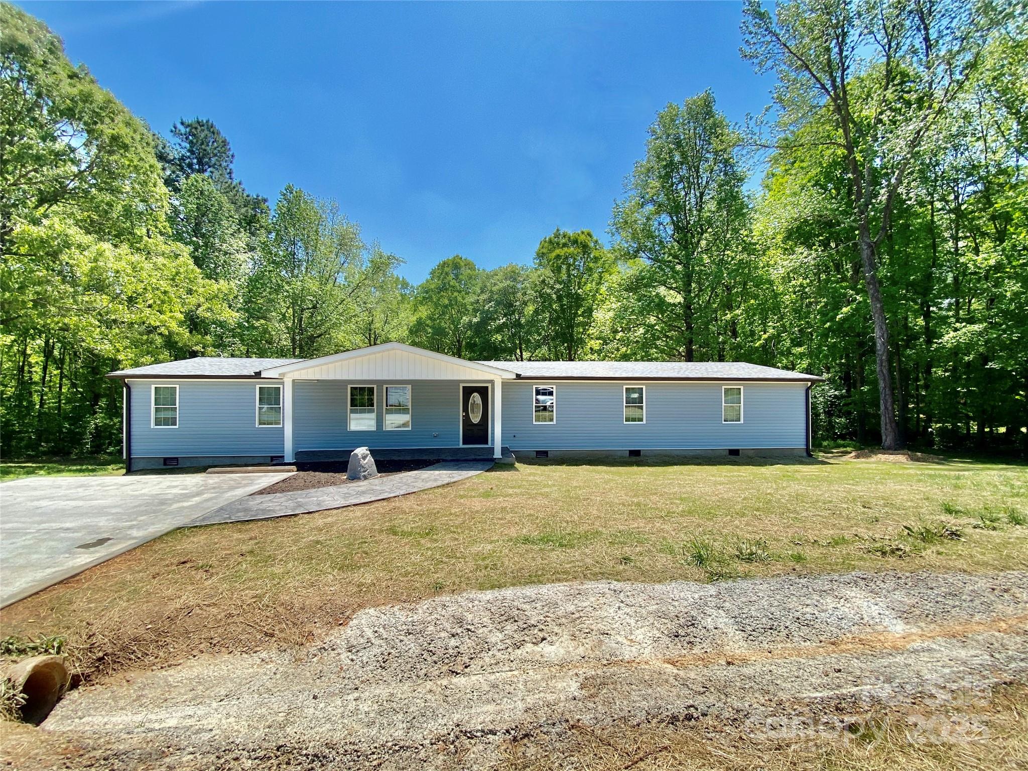 109 Bee Tree Lane Salisbury, NC 28144 - Photo 2 of 39 a house with trees in front of it
