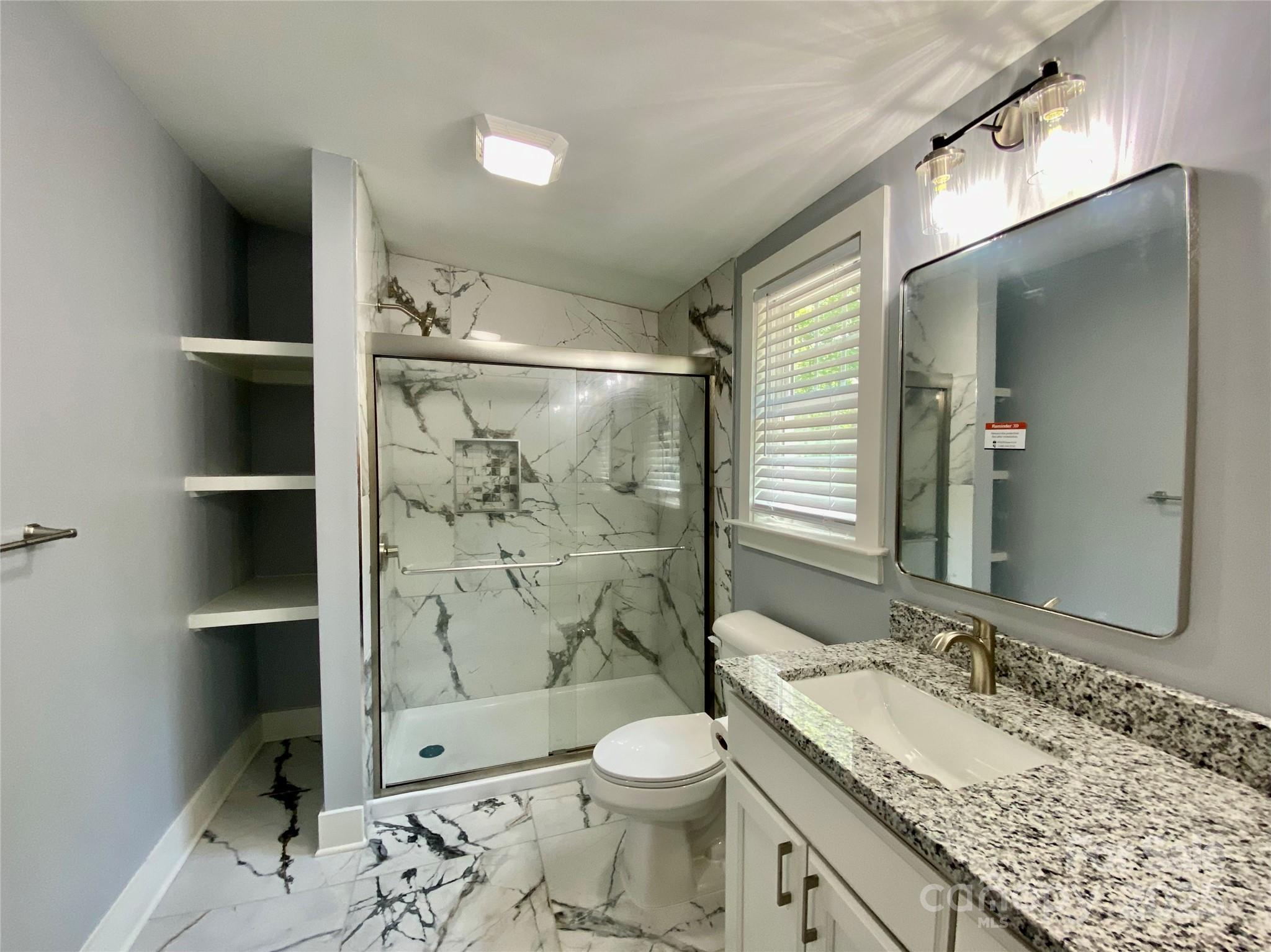 109 Bee Tree Lane Salisbury, NC 28144 - Photo 21 of 39 a bathroom with a granite countertop sink toilet and shower