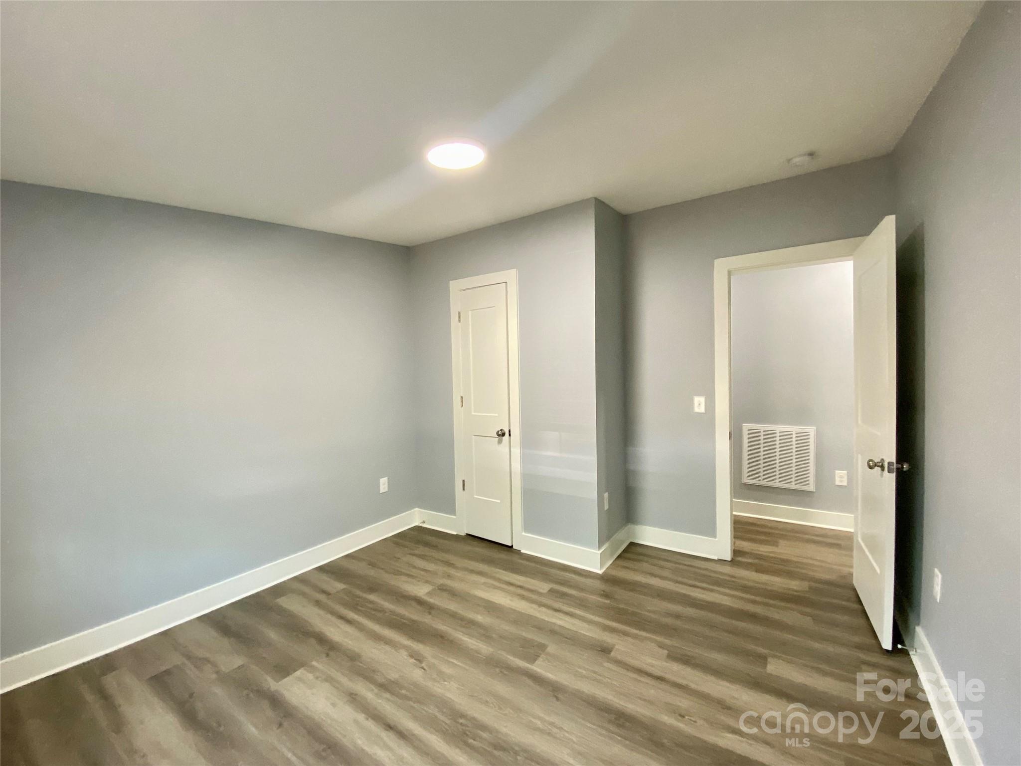 109 Bee Tree Lane Salisbury, NC 28144 - Photo 25 of 39 a view of a room with wooden floor and a bathroom
