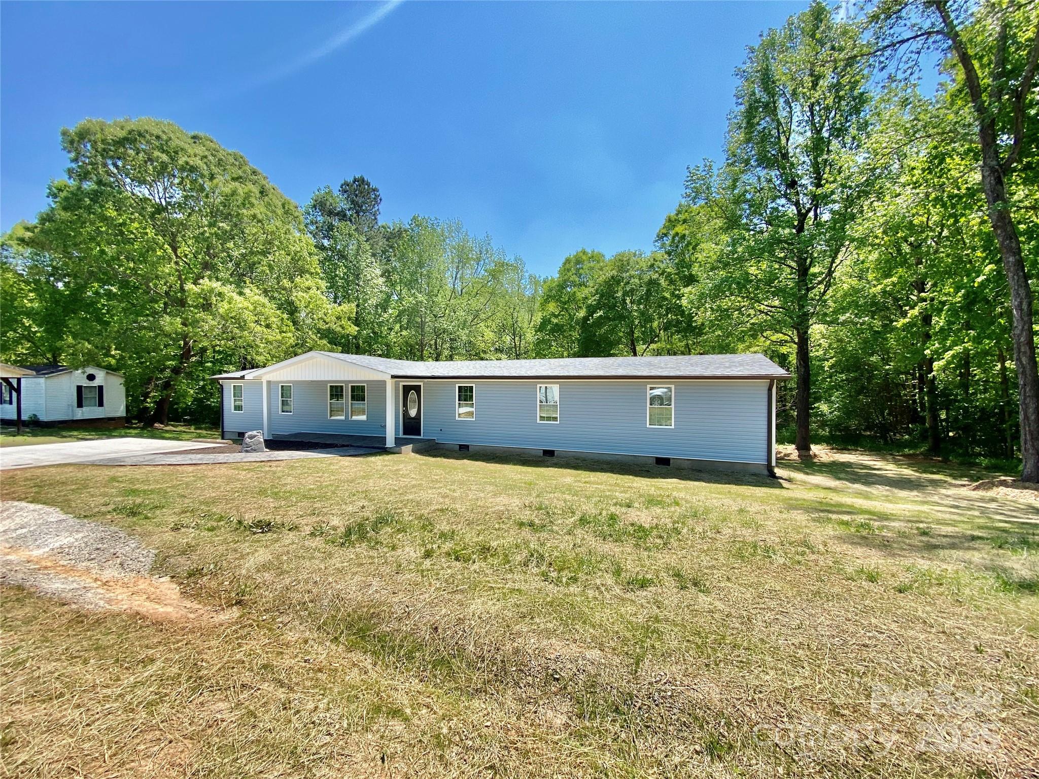 109 Bee Tree Lane Salisbury, NC 28144 - Photo 3 of 39 a house with trees in the background