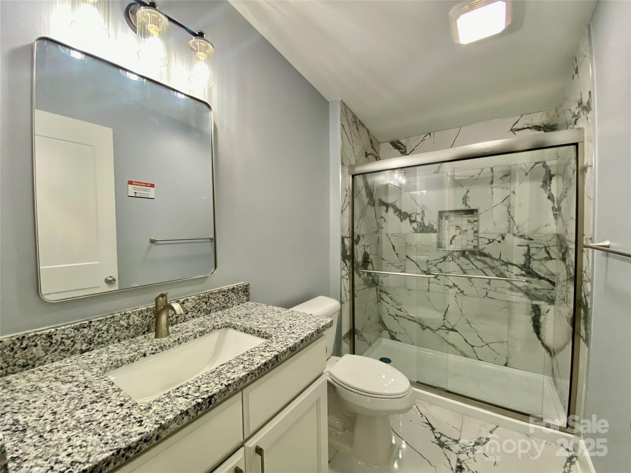 109 Bee Tree Lane Salisbury, NC 28144 - Photo 32 of 39 a bathroom with a granite countertop sink toilet and shower