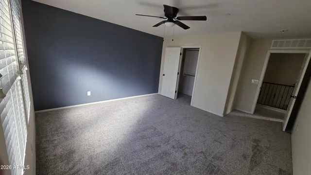 a view of a hallway with a window