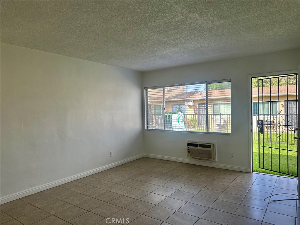 5147 Canoga Street, Unit A Montclair, CA 91763 - Photo 2 of 10 an empty room with windows