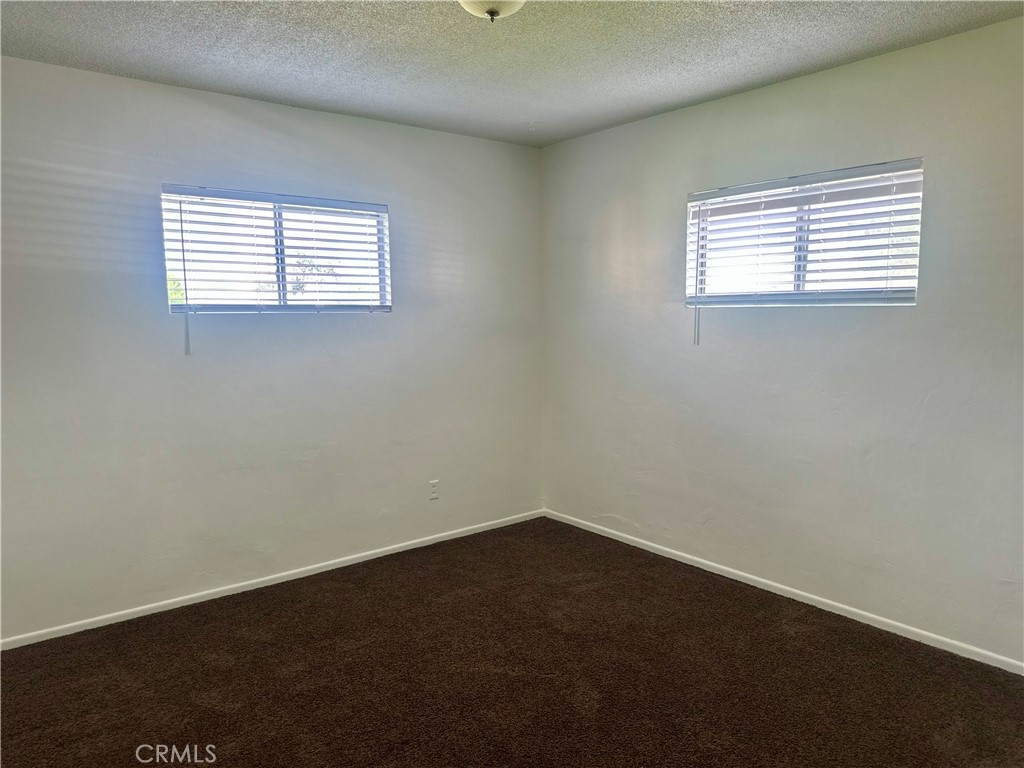 5147 Canoga Street, Unit A Montclair, CA 91763 - Photo 6 of 10 an empty room with a window