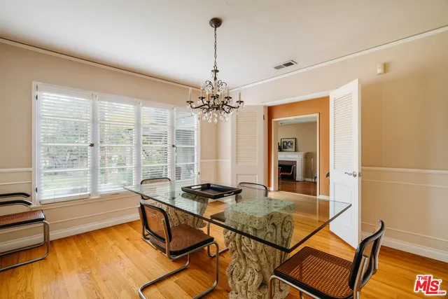 a kitchen with a refrigerator and a stove top oven