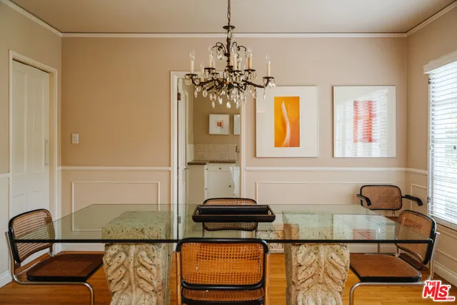 a view of a dining room with furniture and window