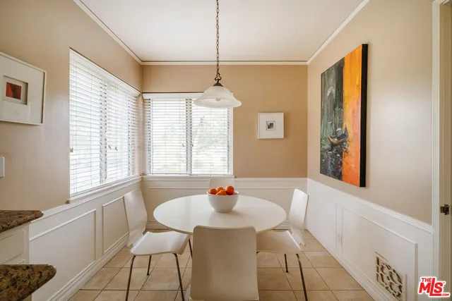 a kitchen with stainless steel appliances a refrigerator and a refrigerator