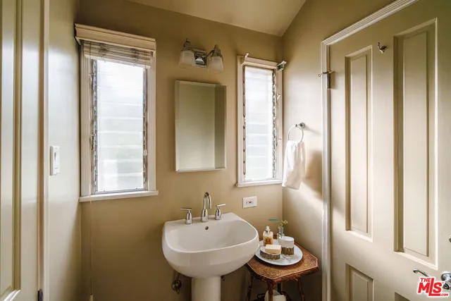 a bathroom with a sink and mirror