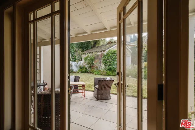 a view of a house with a yard and garage