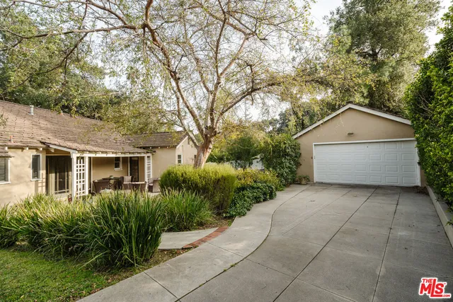 an aerial view of a house with a yard and lake view