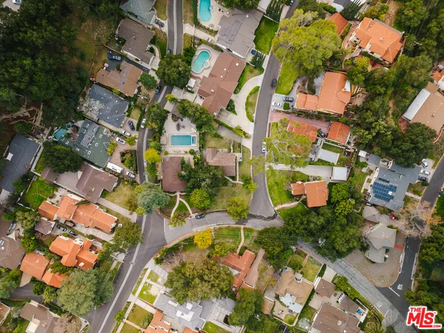 an aerial view of city and mountain