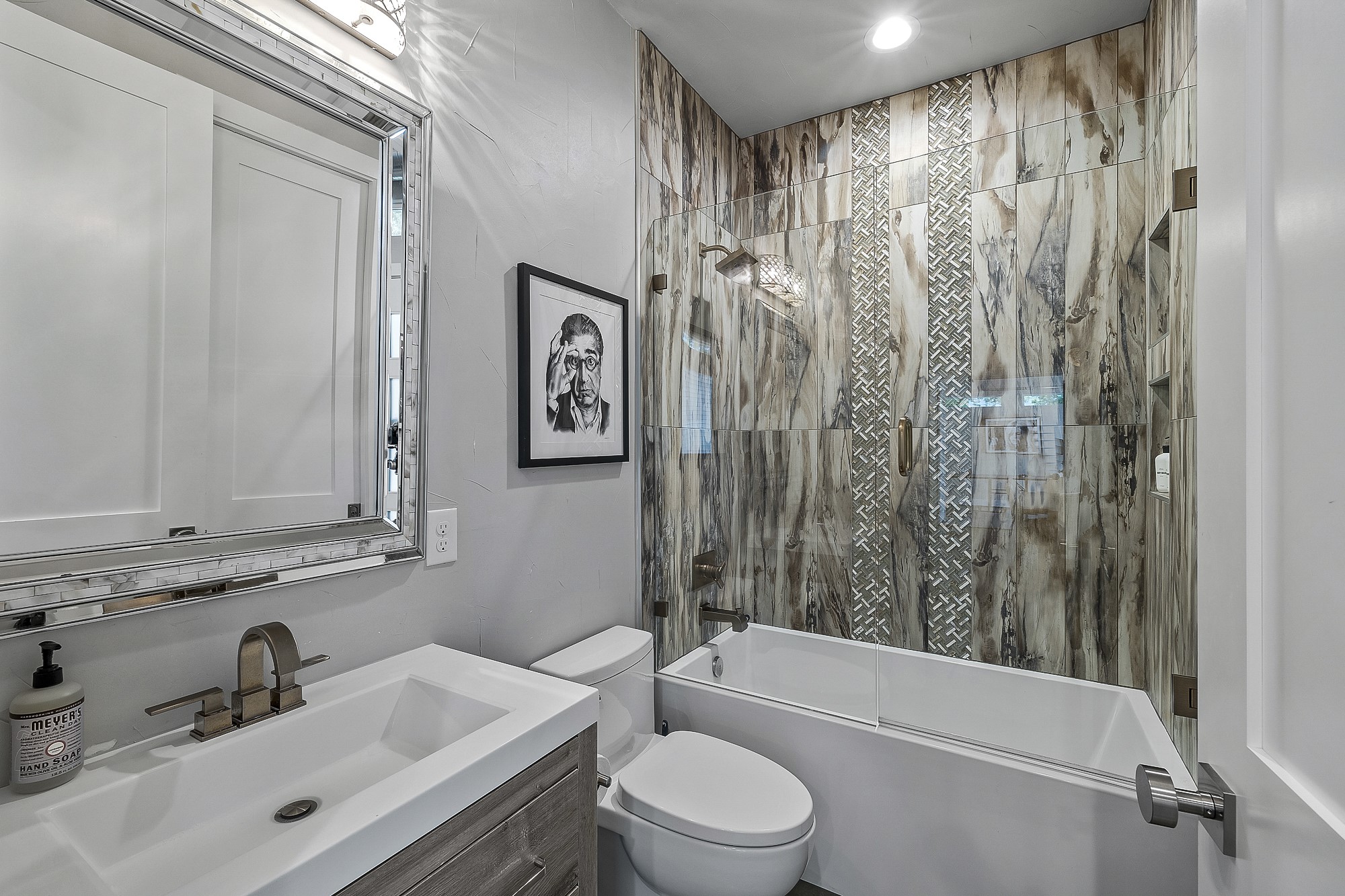 2414 Kinney Road Austin, TX 78704 - Photo 37 of 40 a bathroom with a sink a toilet and shower curtain
