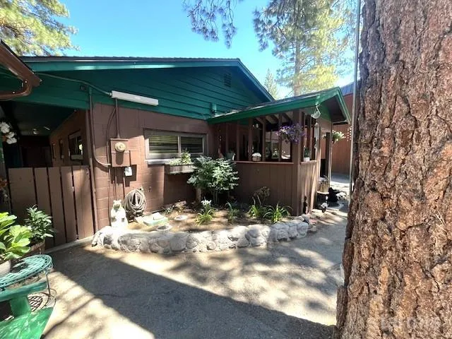 a view of house with outdoor seating