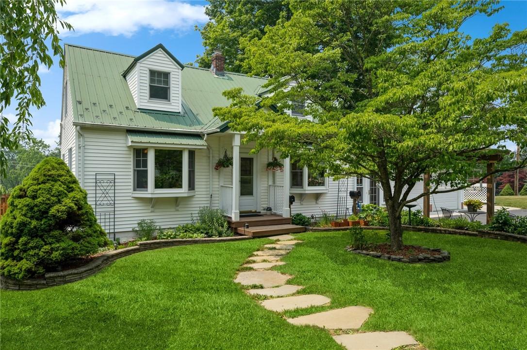 Welcome to this charming Cape Cod and the entrance to the upstairs unit.