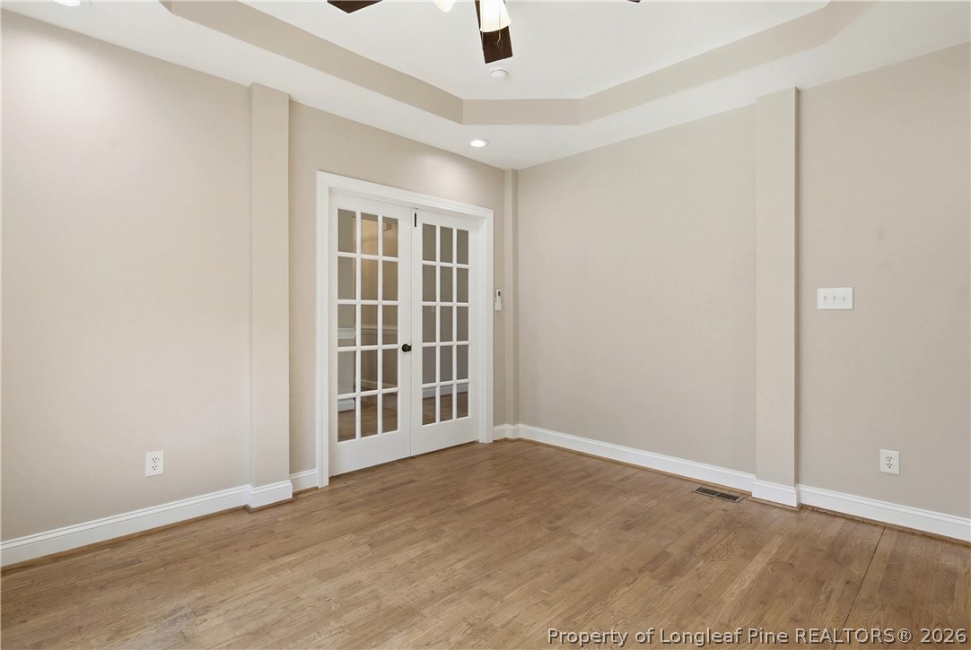 152 Ham Road Hope Mills, NC 28348 - Photo 12 of 50 an empty room with wooden floor and windows