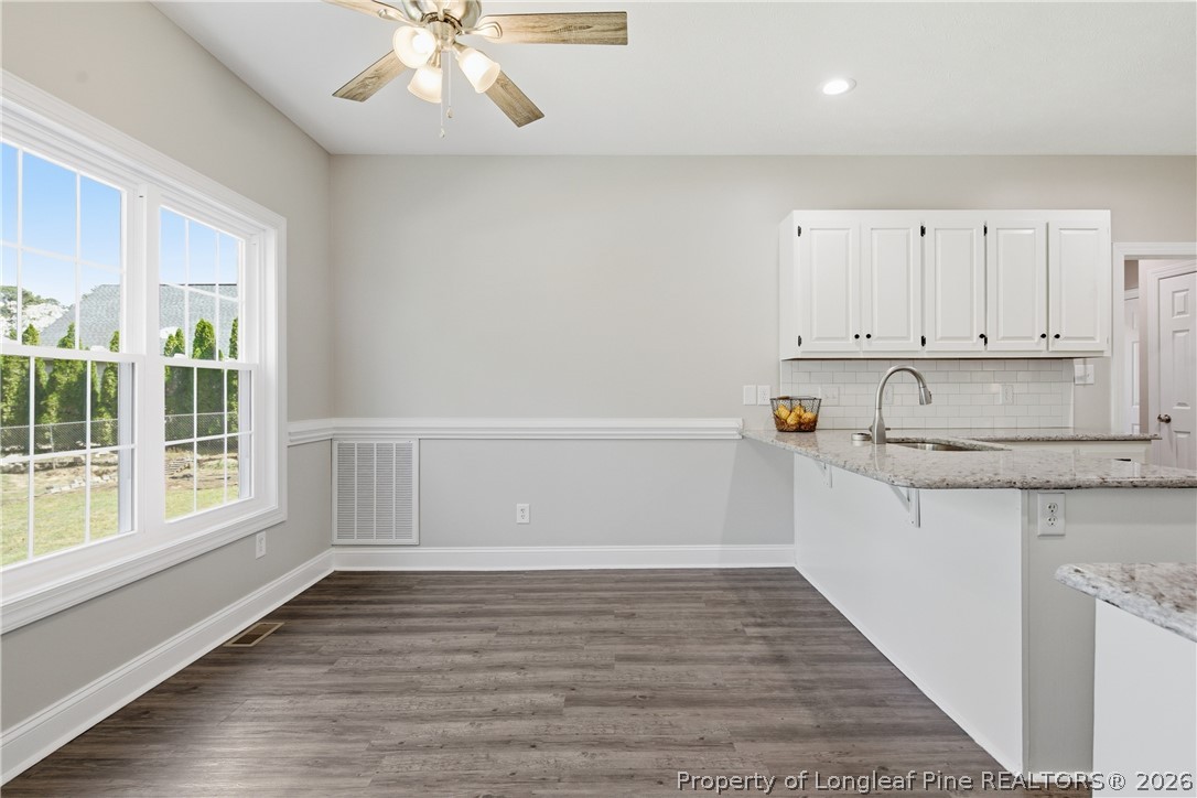 152 Ham Road Hope Mills, NC 28348 - Photo 13 of 50 a view of kitchen with wooden floor and window