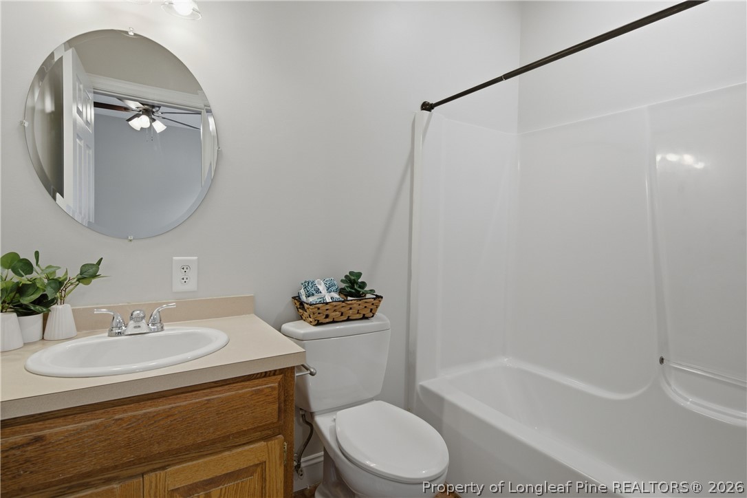 152 Ham Road Hope Mills, NC 28348 - Photo 25 of 50 a bathroom with a sink toilet and bathtub