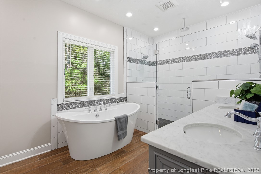 152 Ham Road Hope Mills, NC 28348 - Photo 30 of 50 a bathroom with a sink and a bathtub