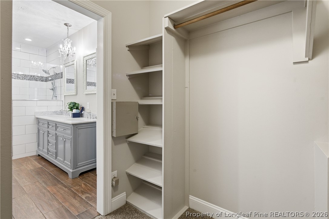 152 Ham Road Hope Mills, NC 28348 - Photo 35 of 50 a view of a hallway with wooden floor and staircase