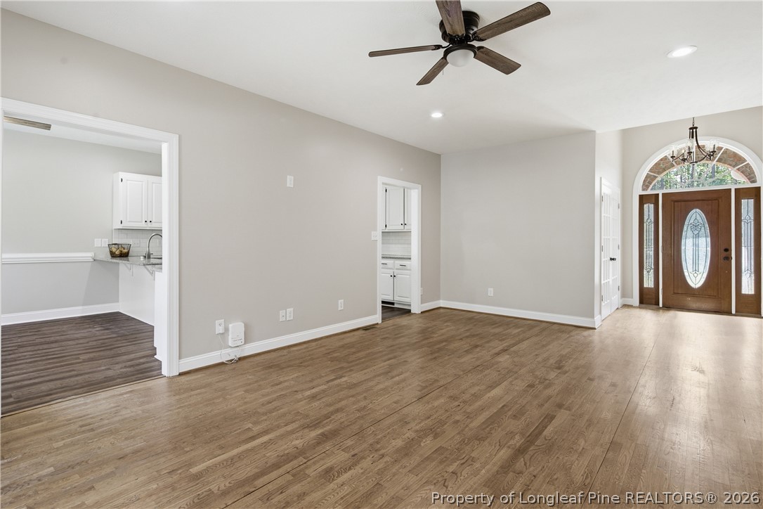 152 Ham Road Hope Mills, NC 28348 - Photo 9 of 50 a view of empty room with wooden floor and window