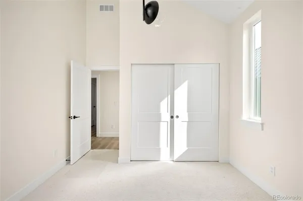 a view of an empty room with windows