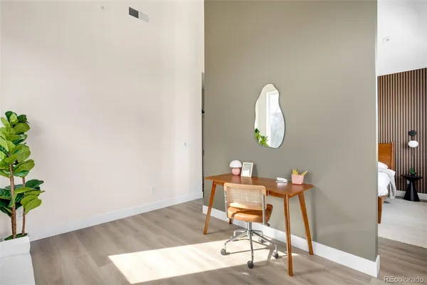 a workspace with furniture and wooden floor