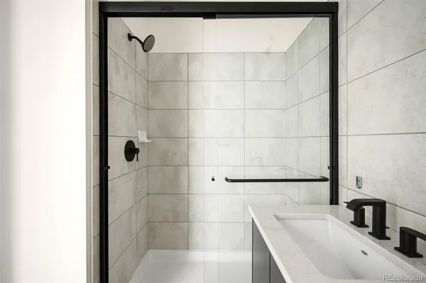 a bathroom with a bathtub and shower