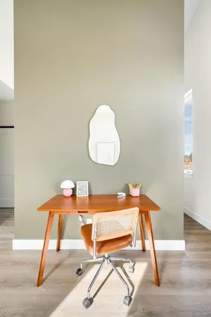 a workspace with furniture and a mirror