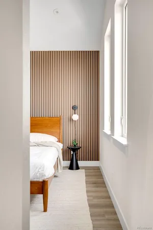 a view of a room with wooden floor and a window