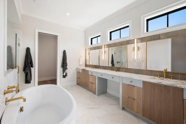 a bathroom with a bathtub and shower