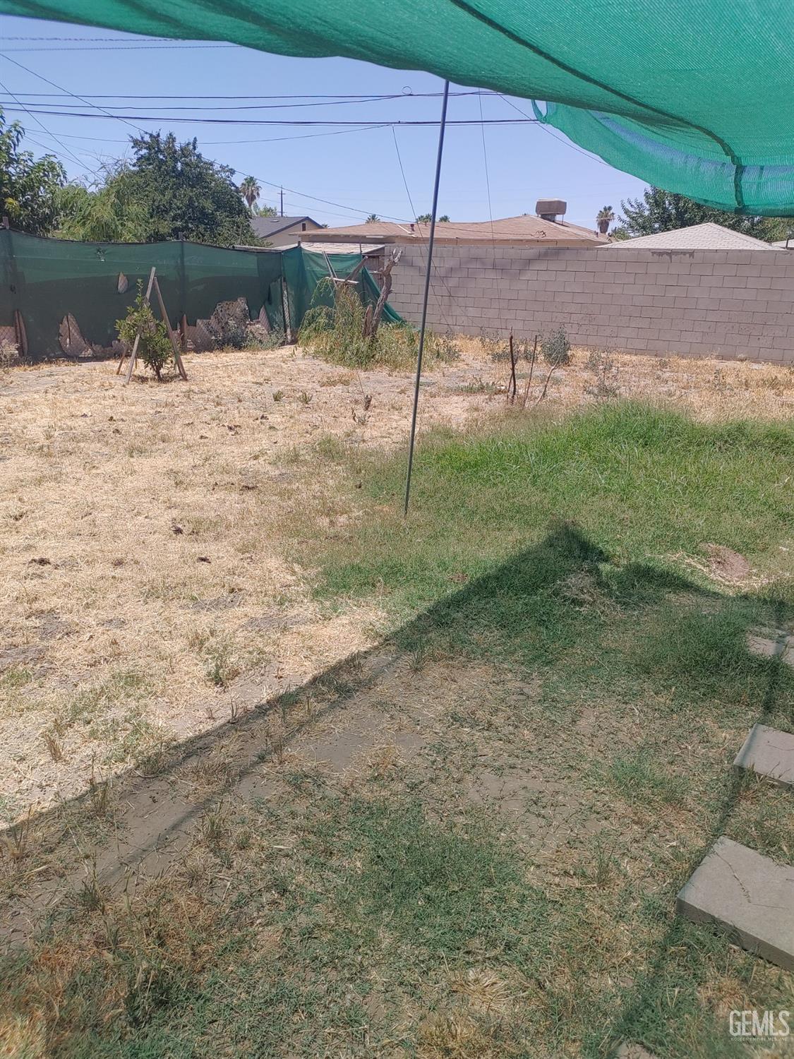 Undisclosed Address Bakersfield, CA 93307 - Photo 4 of 7 a view of a backyard of a house