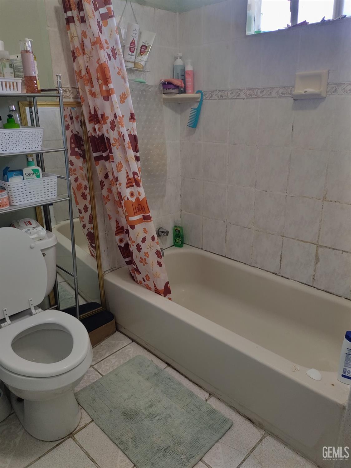 Undisclosed Address Bakersfield, CA 93307 - Photo 7 of 7 a white toilet sitting next to a bath tub