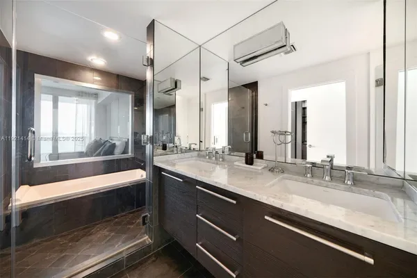 a bathroom with a sink and a large mirror