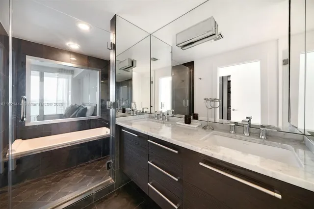 a bathroom with a sink and a large mirror