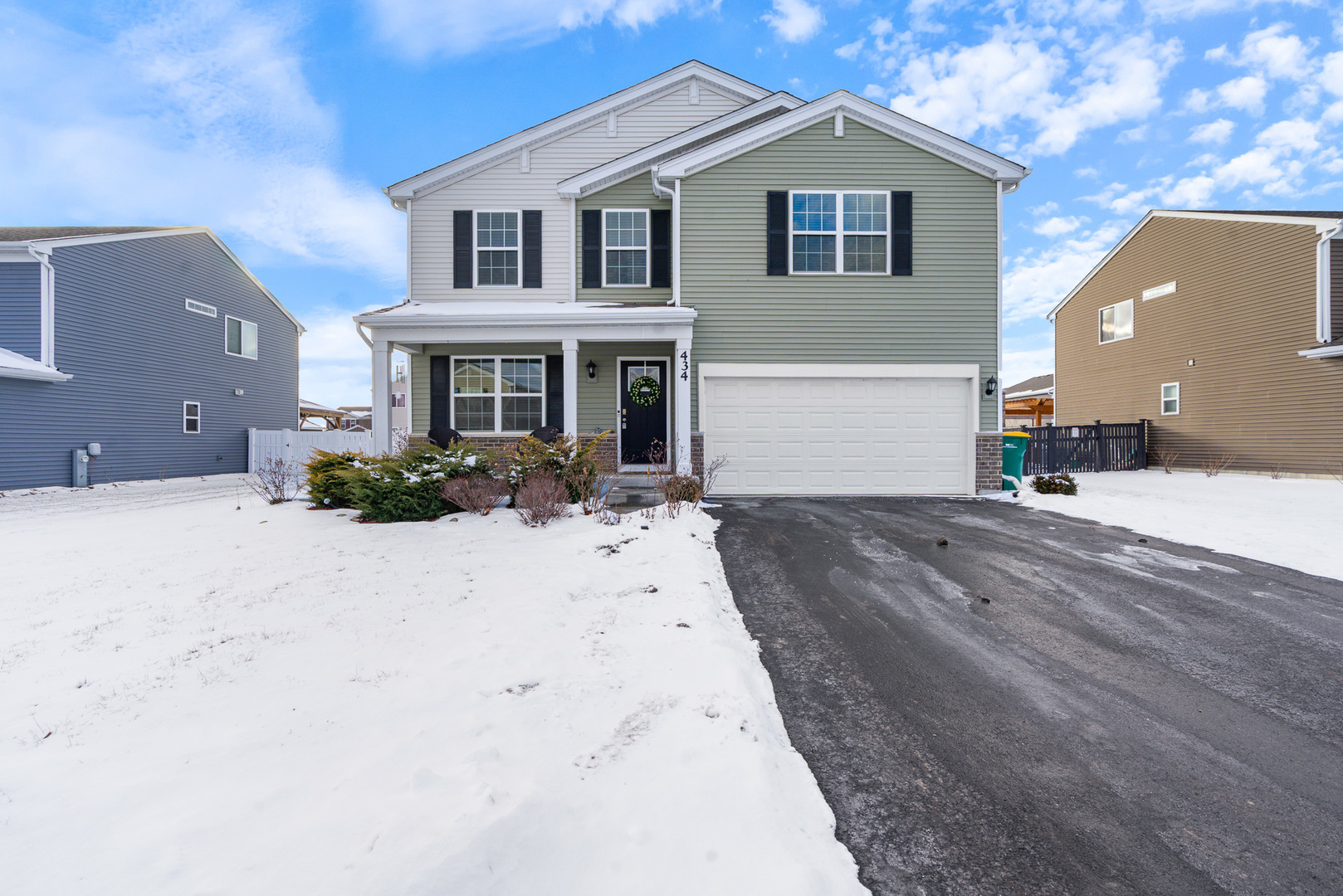a view of a white house with a yard