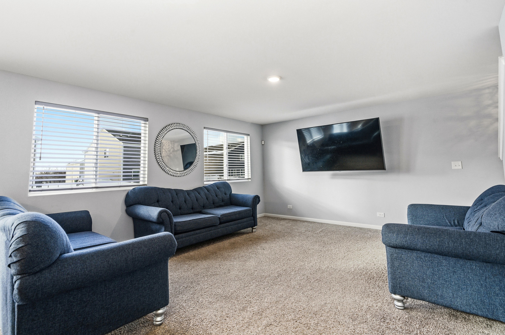 434 Stonebrook Drive Romeoville, IL 60446 - Photo 15 of 38 a living room with furniture and a flat screen tv