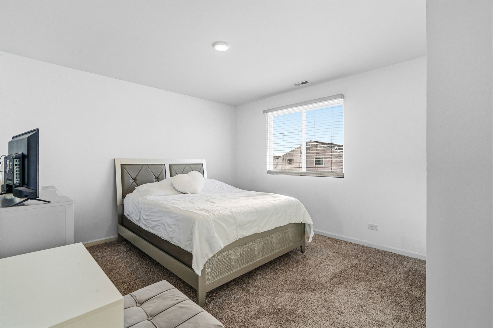 434 Stonebrook Drive Romeoville, IL 60446 - Photo 20 of 38 a bedroom with a bed and a window