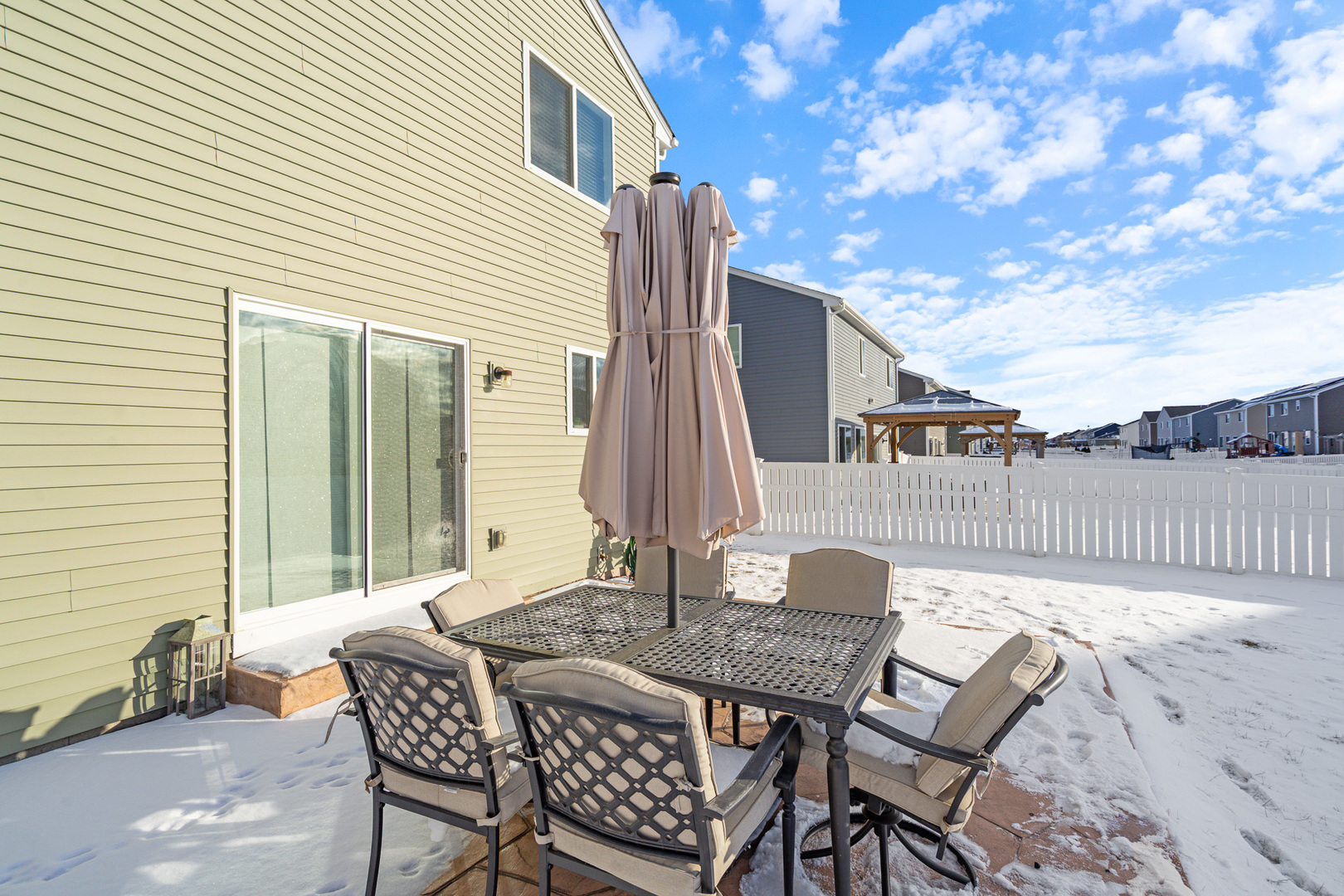 434 Stonebrook Drive Romeoville, IL 60446 - Photo 29 of 38 a view of a patio with a table and chairs