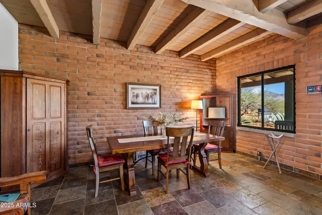 a view of a dining room with furniture and window