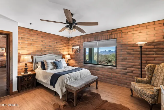 a bedroom with a bed couch and window