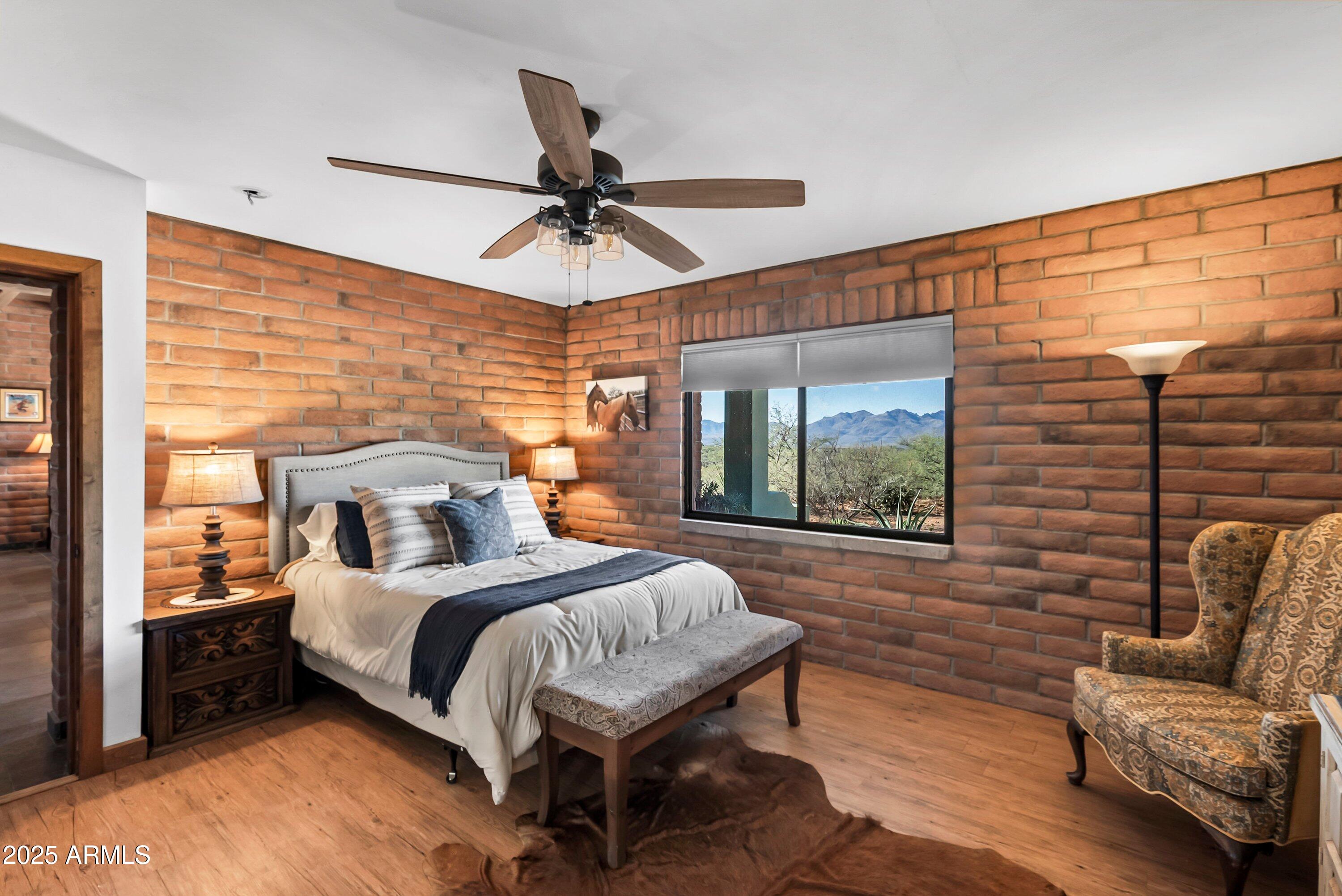 78 Camino Murphy Rio Rico, AZ 85648 - Photo 13 of 51 a bedroom with a bed couch and window