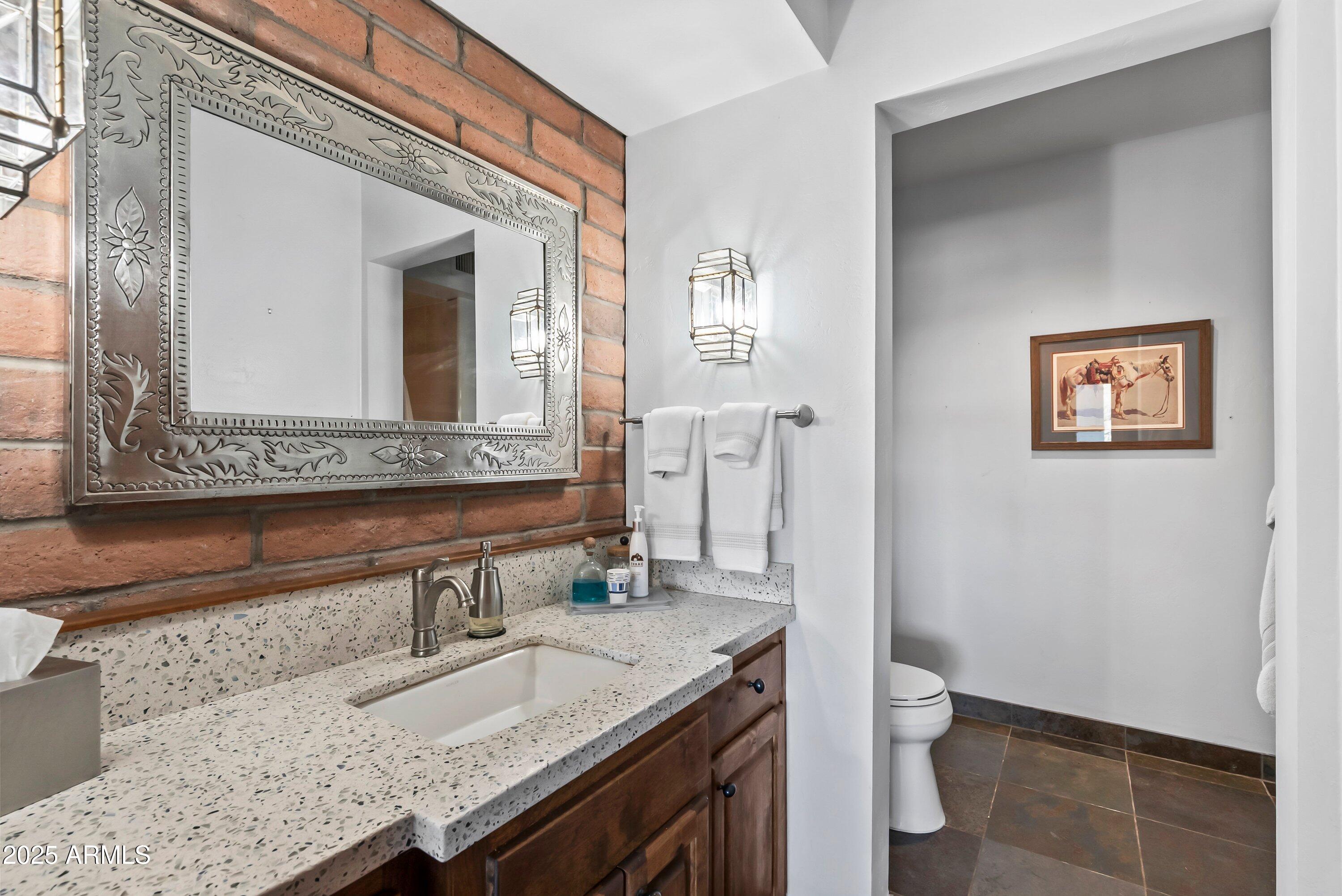78 Camino Murphy Rio Rico, AZ 85648 - Photo 14 of 51 a bathroom with a granite countertop double vanity sink and a mirror