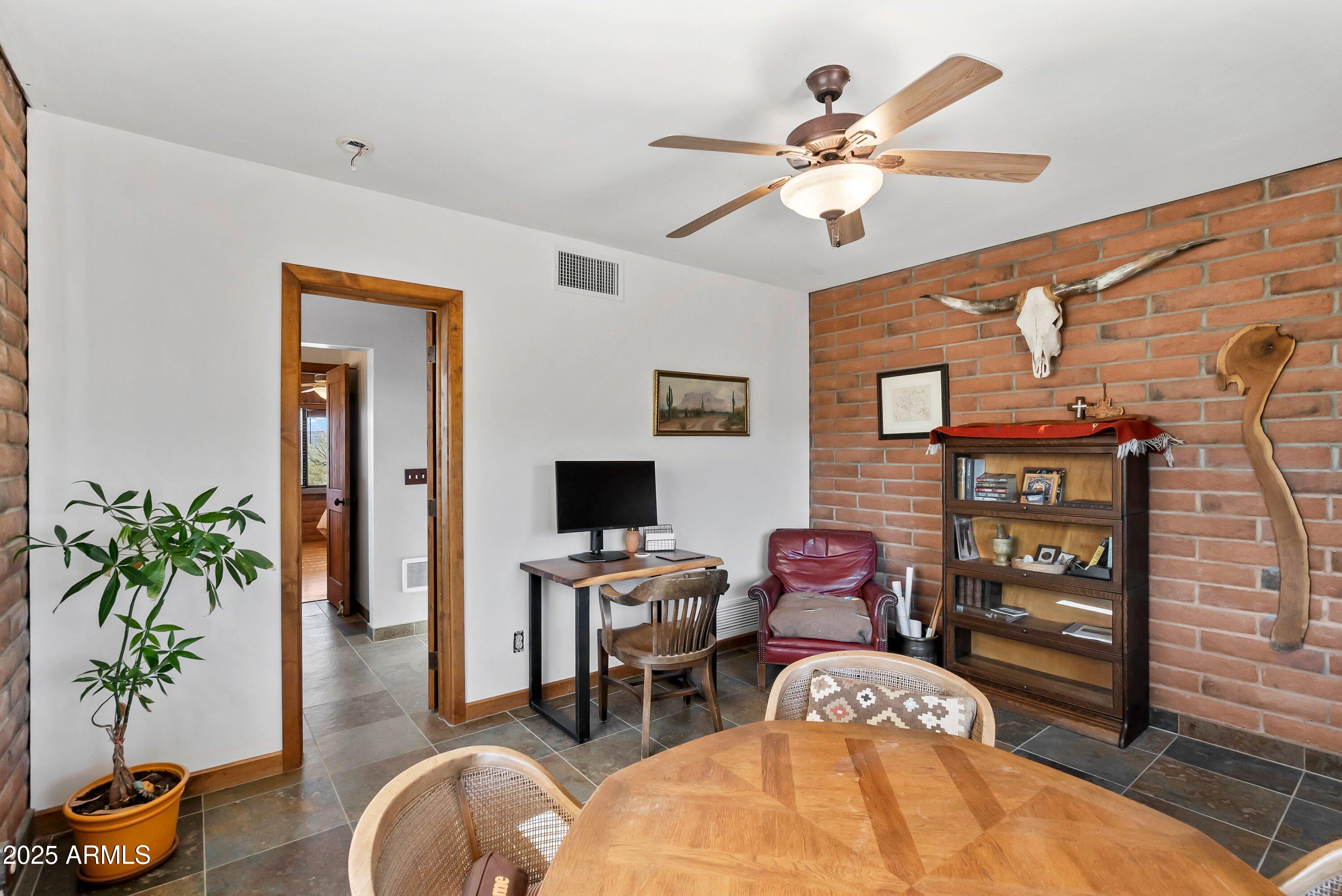 78 Camino Murphy Rio Rico, AZ 85648 - Photo 18 of 51 a living room with furniture a chandelier and a flat screen tv