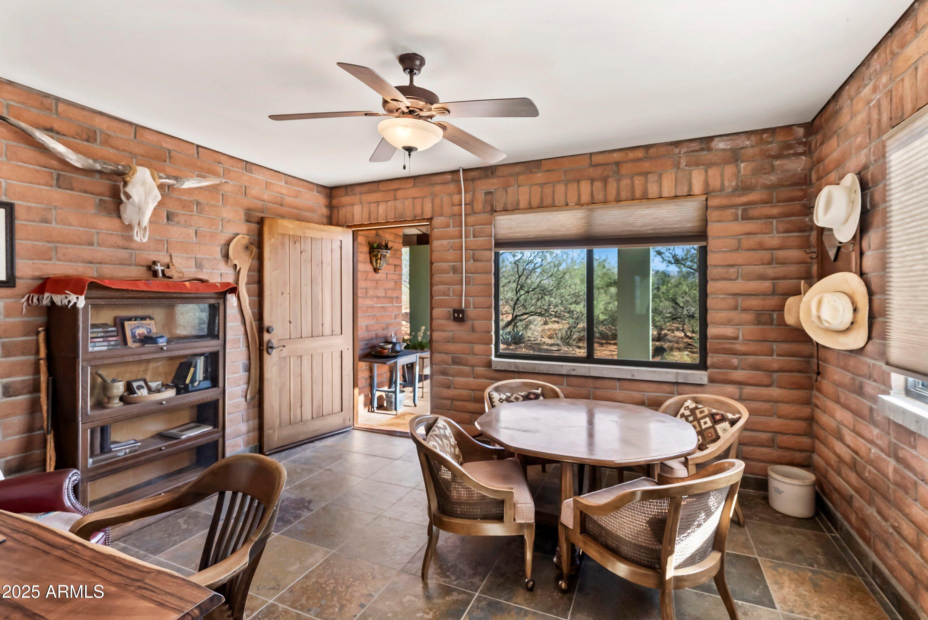 78 Camino Murphy Rio Rico, AZ 85648 - Photo 19 of 51 a view of a dining room with furniture window and wooden floor