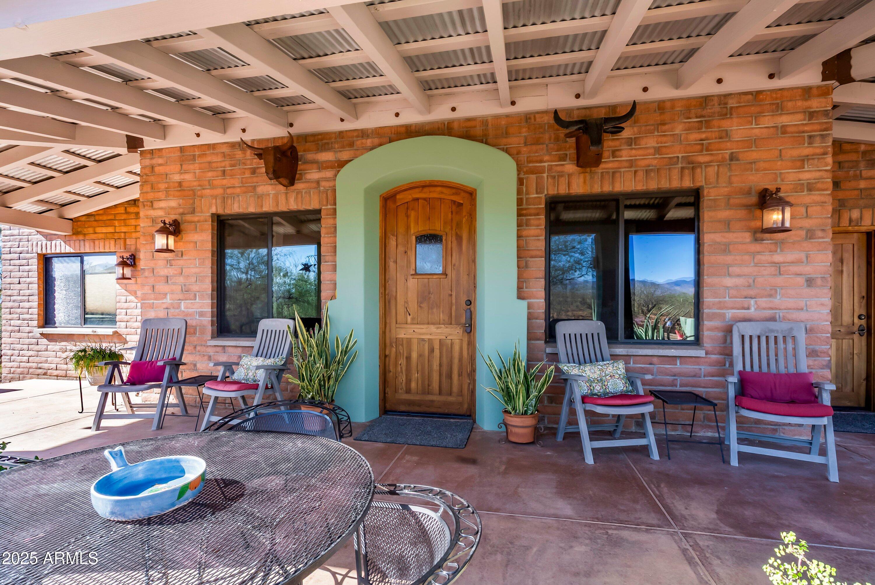 78 Camino Murphy Rio Rico, AZ 85648 - Photo 2 of 51 a living room with furniture and a fireplace