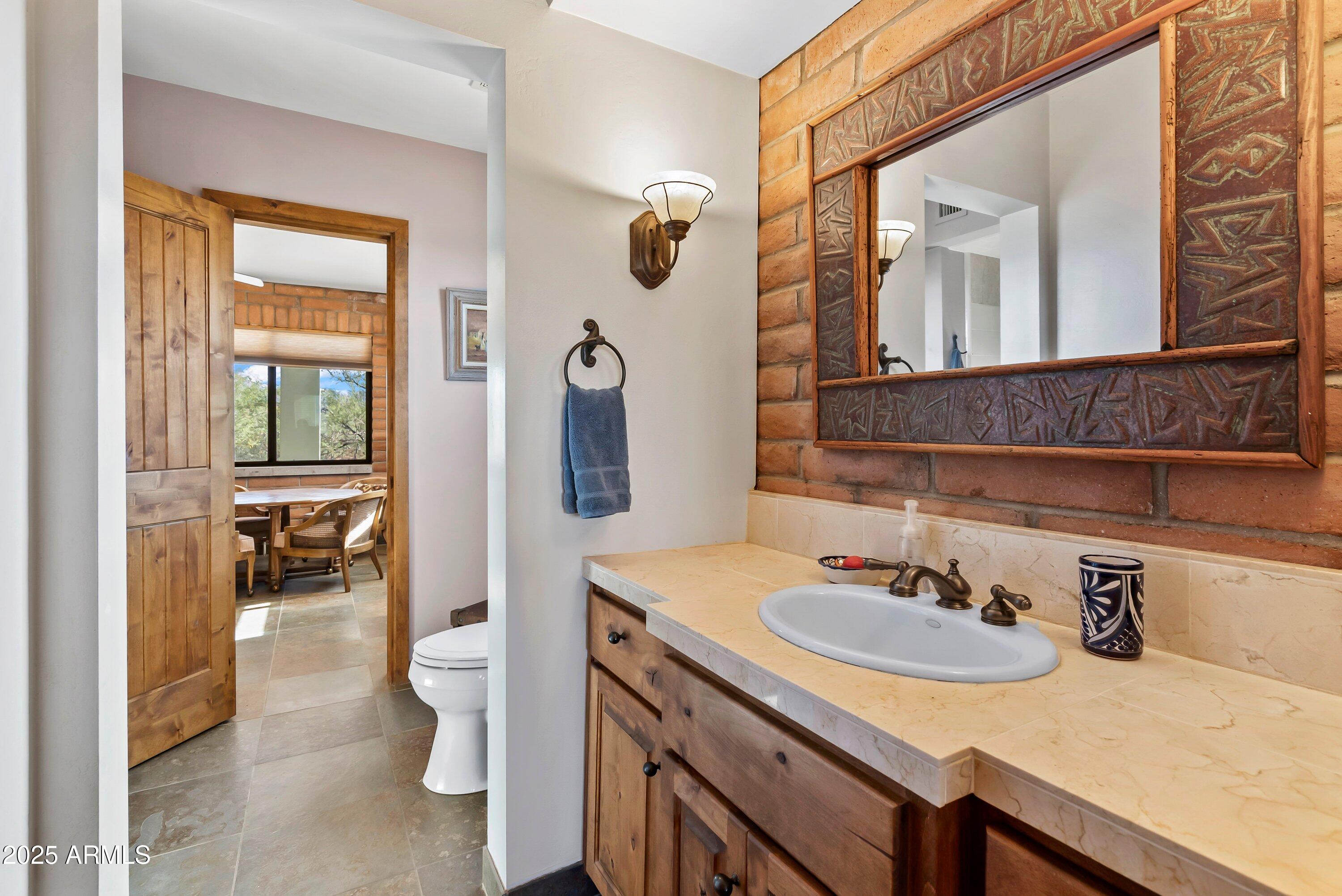 78 Camino Murphy Rio Rico, AZ 85648 - Photo 23 of 51 a bathroom with a sink and a mirror