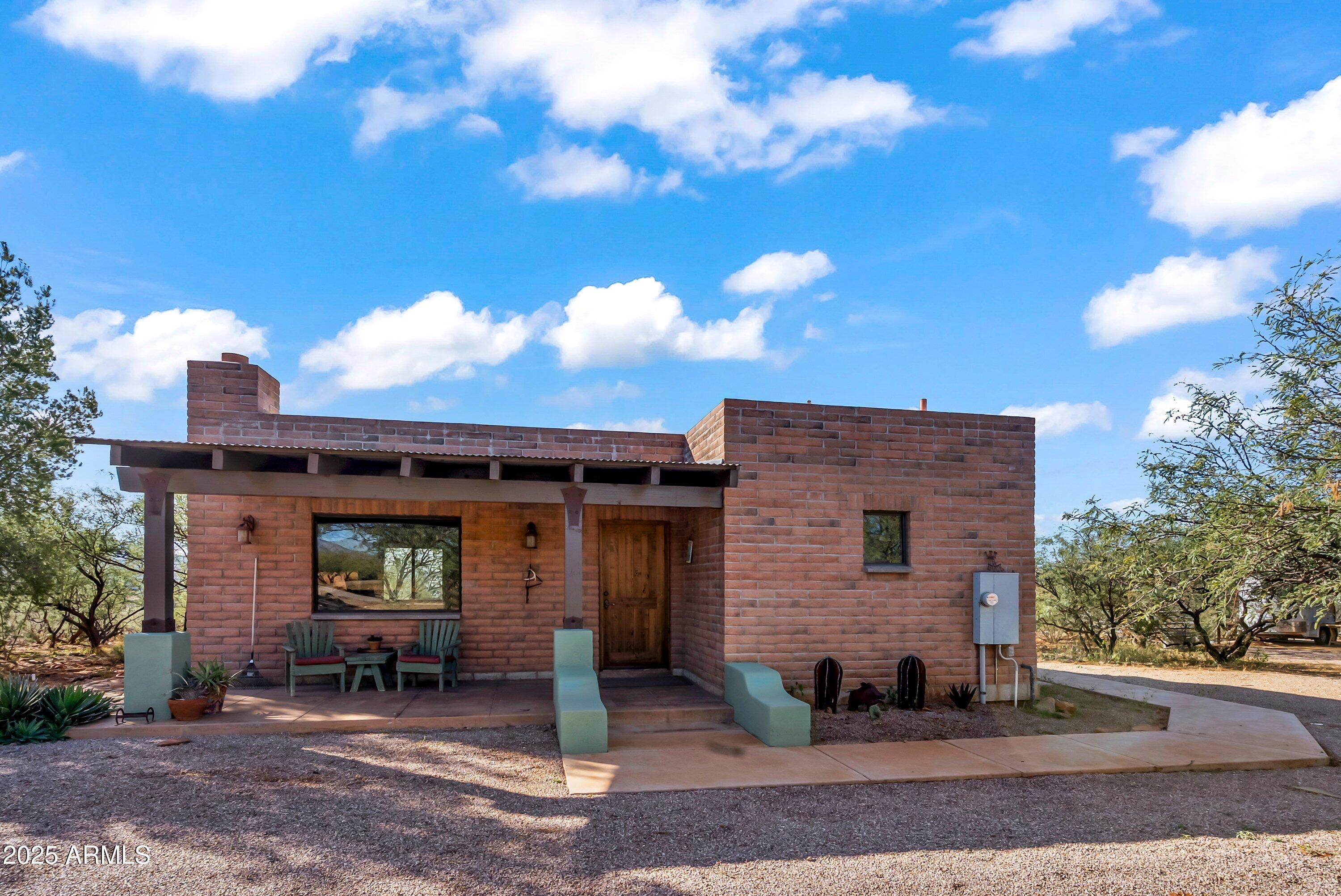 78 Camino Murphy Rio Rico, AZ 85648 - Photo 28 of 51 a front view of a house with a yard