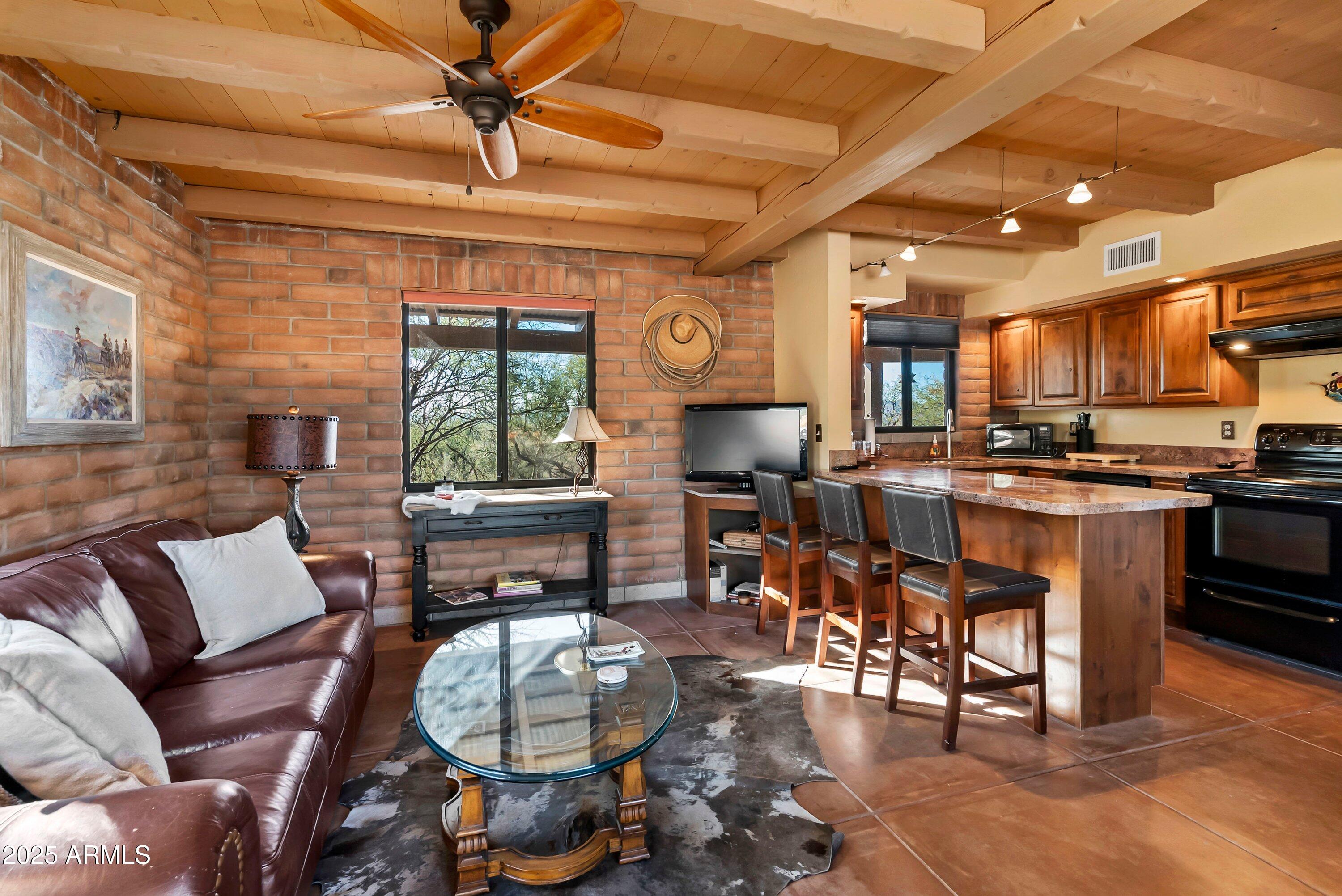 78 Camino Murphy Rio Rico, AZ 85648 - Photo 33 of 51 a living room with lots of furniture and kitchen view